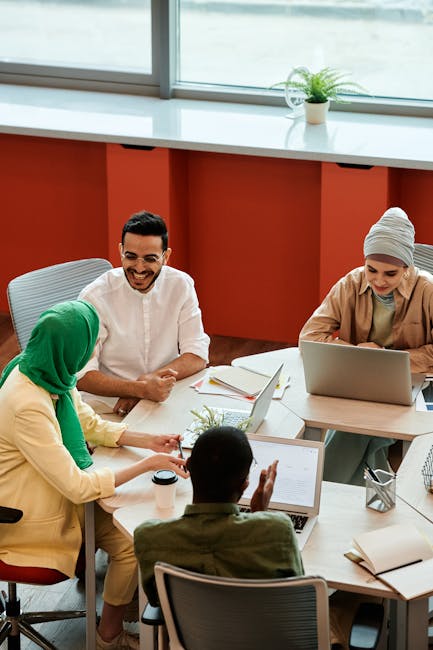 A group of diverse people sitting calmly in a bright, modern space.